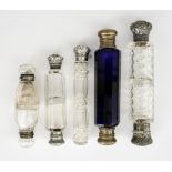 A Victorian Silver Mounted and Cut Glass Cylindrical Scent Bottle and Four Double Ended Scent