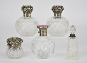 A Pair of Late Victorian Silver Mounted and Cut Glass Spherical Scent Bottles and Three Others,