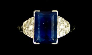 A Platinum Sapphire and Diamond Ring, 20th Century, set with a centre faceted sapphire,