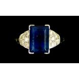 A Platinum Sapphire and Diamond Ring, 20th Century, set with a centre faceted sapphire,