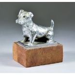 An Asprey Plated Metal Figure of a Terrier, on rectangular base, stamped Asprey, 3.5ins high, on