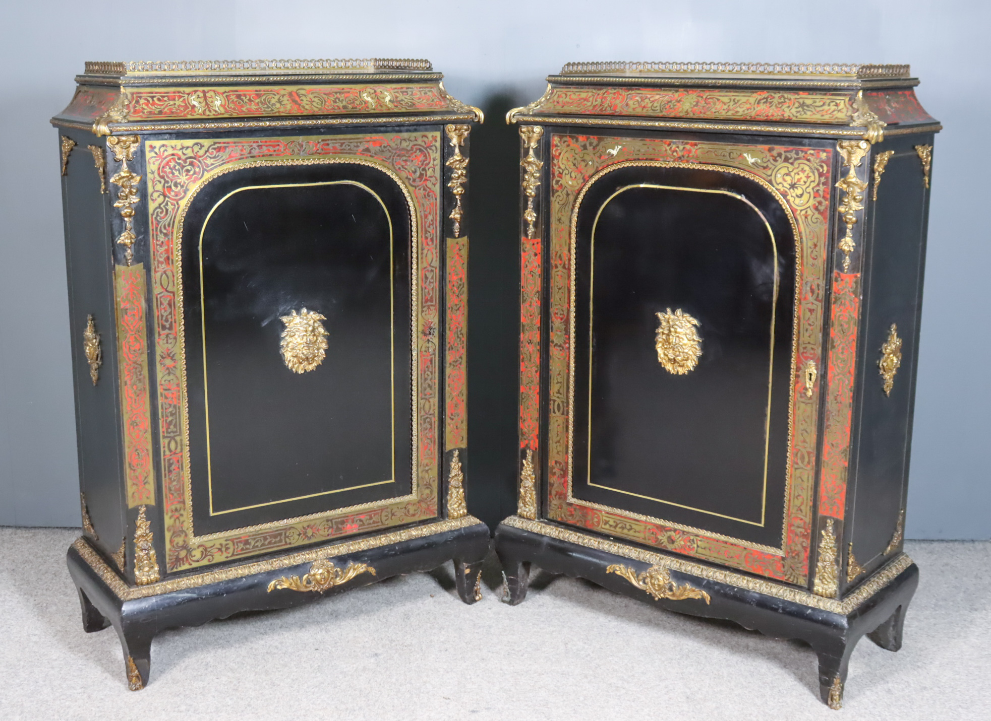 A Pair of 19th Century French Ebonised and Red Tortoiseshell Boulle Pier Cabinets, with gilt brass