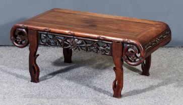 A Chinese Hardwood Rectangular Opium Table, the flush panel top with scrolled ends, bamboo moulded