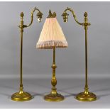 A Gilt Metal Table Lamp, Early 20th Century, the base, lower column and S-shaped lamp holder cast