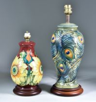 Two Moorcroft Pottery Table Lamps on Wooden Bases, one decorated in "Peacock" pattern, 12ins high