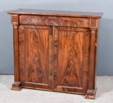 A George IV Figured Mahogany Dwarf Cabinet, with square edge to top, fitted one frieze drawer,