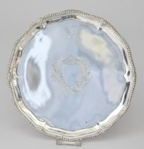 A George III Silver Circular Waiter by William Turton or Walter Tweedie, London 1779, the shaped and