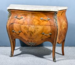 A 19th Century Continental Kingwood, Marquetry and Gilt Metal Mounted Commode of shaped outline,