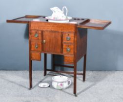 A George III Mahogany Enclosed Wash Stand, the top opening to reveal rising mirror and six bowl