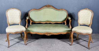 A French Beech Framed Settee in the Louis XV Style, the shaped and moulded frame with scroll