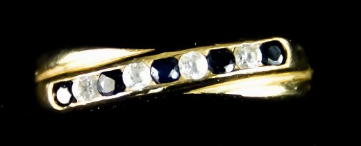 A 9ct Gold Sapphire and Diamond Ring, set with five small sapphire stones and four small diamonds,
