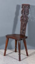 A Late 19th/Early 20th Century Continental Oak Hall Chair, the high back boldly fretted and carved