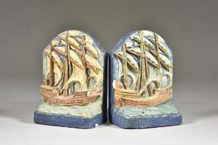 A Pair of Compton Pottery Bookends, Early 20th Century, modelled as galleons in full sail, decorated