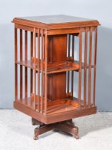 An Edwardian Mahogany and Inlaid Two Tier Revolving Bookcase, with cross banding and moulded edge to
