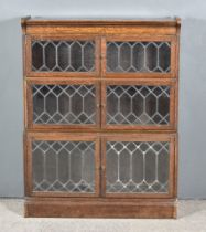 A Three Tier Sectional Bookcase by Minty of Oxford, with leaded glazed doors, 35.25ins wide x 11.