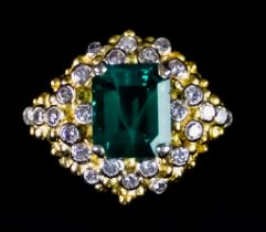 An 18ct Gold Emerald and Diamond Ring, Modern, set with a centre emerald, approximately 3.3ct,