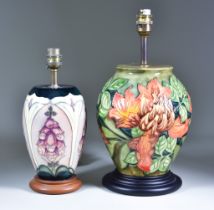 Two Moorcroft Pottery Table Lamps on Wooden Bases, one decorated with "Foxglove" pattern, 8.5ins