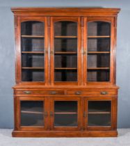 A Late Victorian Walnut Bookcase, the upper part with moulded cornice, fitted nine shelves