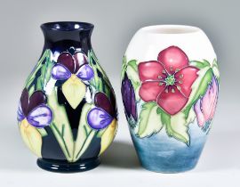 Two Moorcroft Pottery Vases, one of baluster shape decorated with Heartsease pattern on a navy/