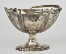 A George III Irish Silver Oval Sugar Basket, by William Bond, Dublin 1800, with shaped and moulded