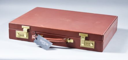 A Tan Leather Attache Case, by Simpson of London, unused with tags but slightly shop soiled, 17 1/