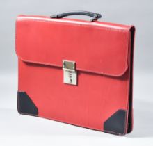 A Red and Black Calf Leather Flap Over Document Case, by Simpson of London, unused but slightly shop