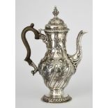 A George III Silver Baluster-Shaped Coffee Pot, maker's mark incomplete, London 1768, the domed