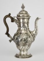 A George III Silver Baluster-Shaped Coffee Pot, maker's mark incomplete, London 1768, the domed