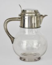 A Victorian Silver Mounted and Clear Glass Claret Jug by William Hutton & Sons, London 1888, the