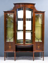 An Edwardian Mahogany Bow and Break Front Display Cabinet, inlaid with stringings and swags,