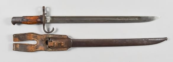 A WWI Japanese Bayonet, bright steel blade, 15.5ins, wooden hilt, in steel scabbard with leather