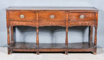 An 18th Century Oak Dresser Base, with moulded edge to top, fitted three frieze drawers, on four