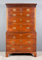 A George III Mahogany Tallboy, the upper part with dentil moulded cornice, fitted two short and