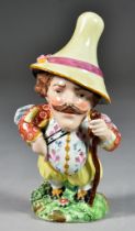 An English Pearlware Pottery Mansion House Dwarf, Circa 1820, his waistcoat painted in enamels