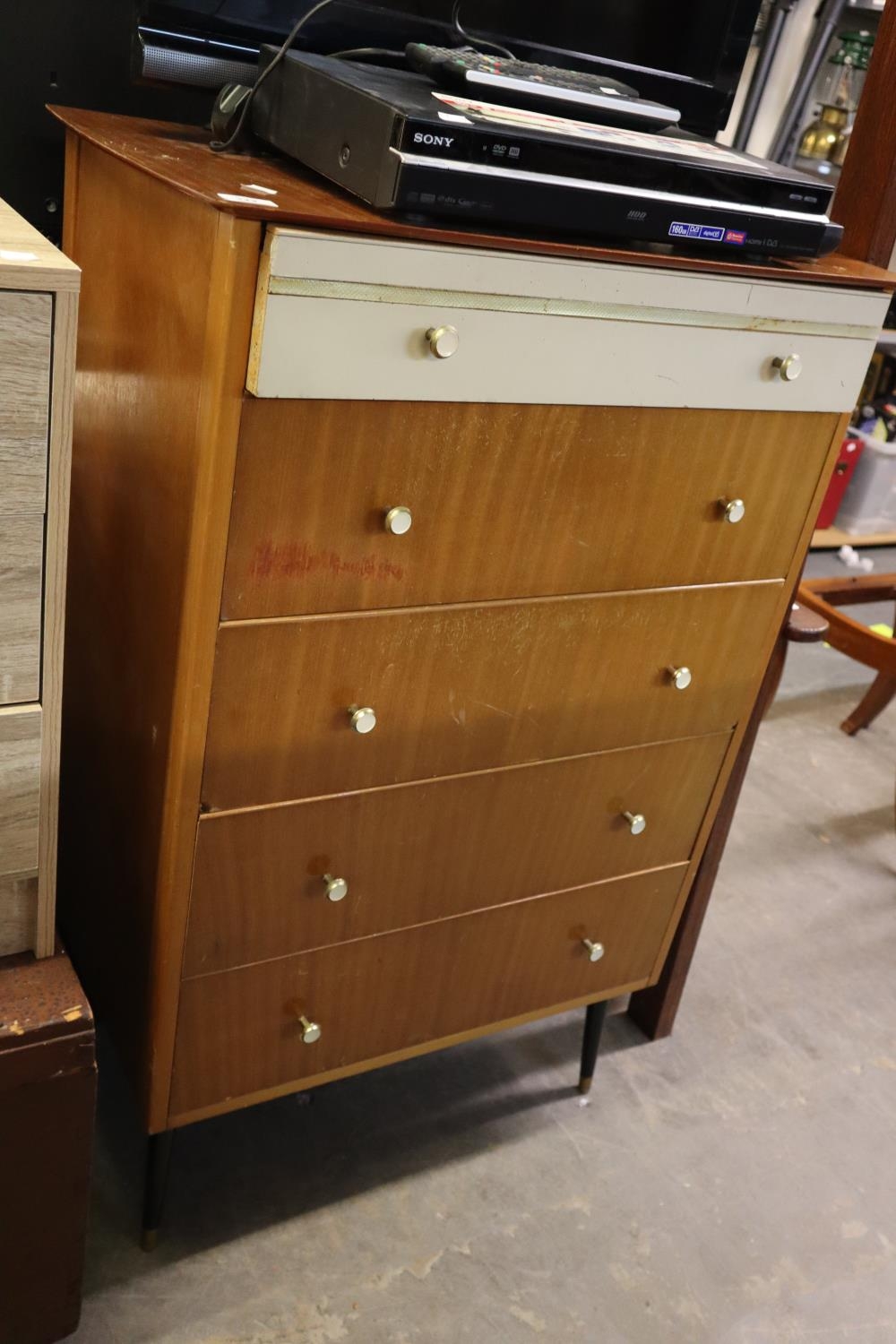 A TEAK CHEST OF FIVE LONG DRAWERS AND A MODERN BEDSIDE CHEST OF THREE DRAWERS (2)