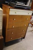 A TEAK CHEST OF FIVE LONG DRAWERS AND A MODERN BEDSIDE CHEST OF THREE DRAWERS (2)