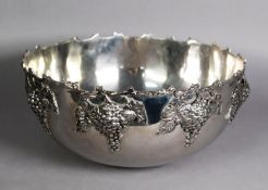LARGE SILVER PLATED PUNCH BOWL with fruiting vine embossed exterior and shaped rustic edge, 14 1/2in