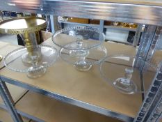 FOUR LARGE GLASS PEDESTAL CAKE STANDS, 11 1/2" (32cm) diameter, PLUS A METAL EXAMPLE (5)