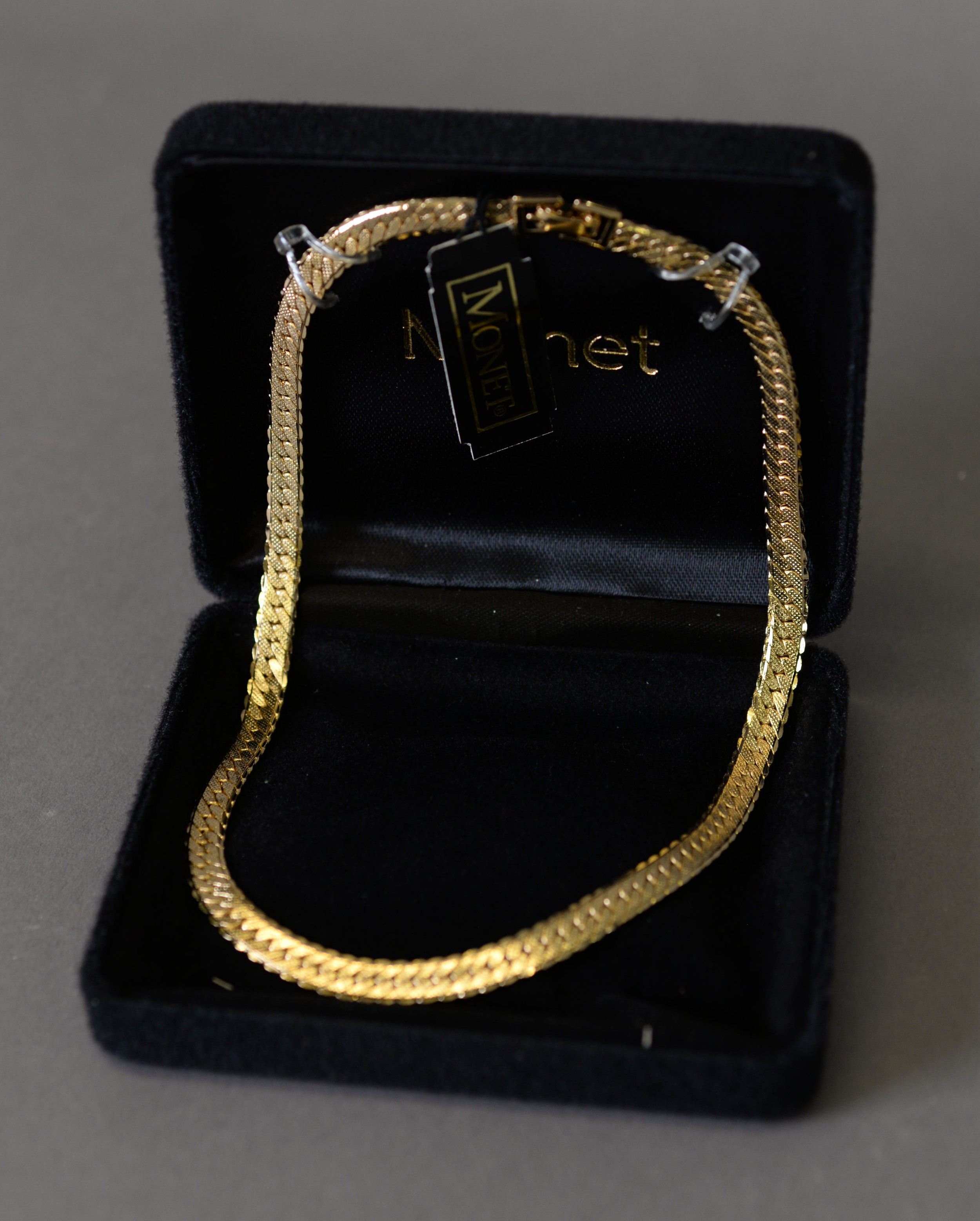 MONET GOLD PLATED SNAKE LINK CHOKER NECKLACE, IN ASSOCIATED CASE WITH CARE INSTRUCTIONS; A TRIPLE - Image 2 of 3