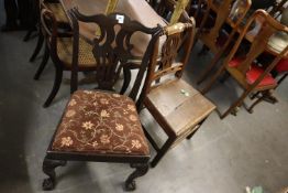A GEORGE III MAHOGANY HALL CHAIR, AND A CHIPPENDALE STYLE MAHOGANY DINING CHAIR WITH DROP-IN SEAT (