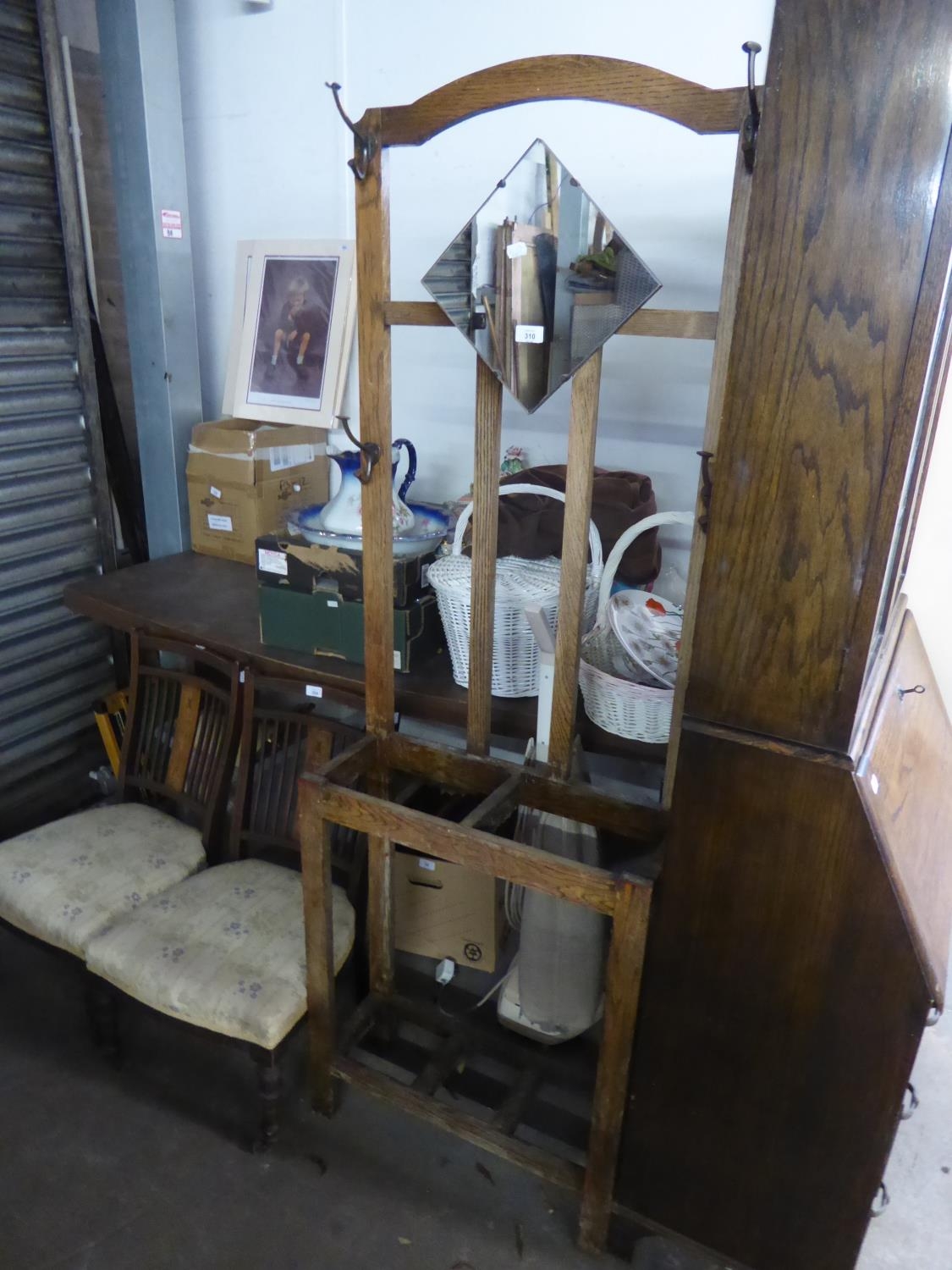 AN OAK HALLSTAND WITH SMALL FITTED MIRROR