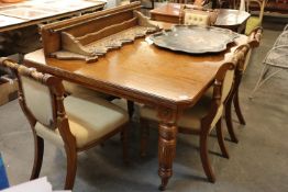 A VICTORIAN OAK WIND-OUT DINING TABLE, HAVING TWO LOOSE LEAVES, RAISED ON TURNED LEGS, (W. 120cm x H