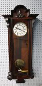 LATE NINETEENTH/ EARLY TWENTIETH CENTURY WALNUT AND EBONISED VIENNA WALL CLOCK, the two part 6 ½”