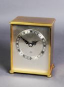 ELLIOTT PRESENTATION GILT METAL MANTLE CLOCK, the silvered dial with Roman chapter ring, powered