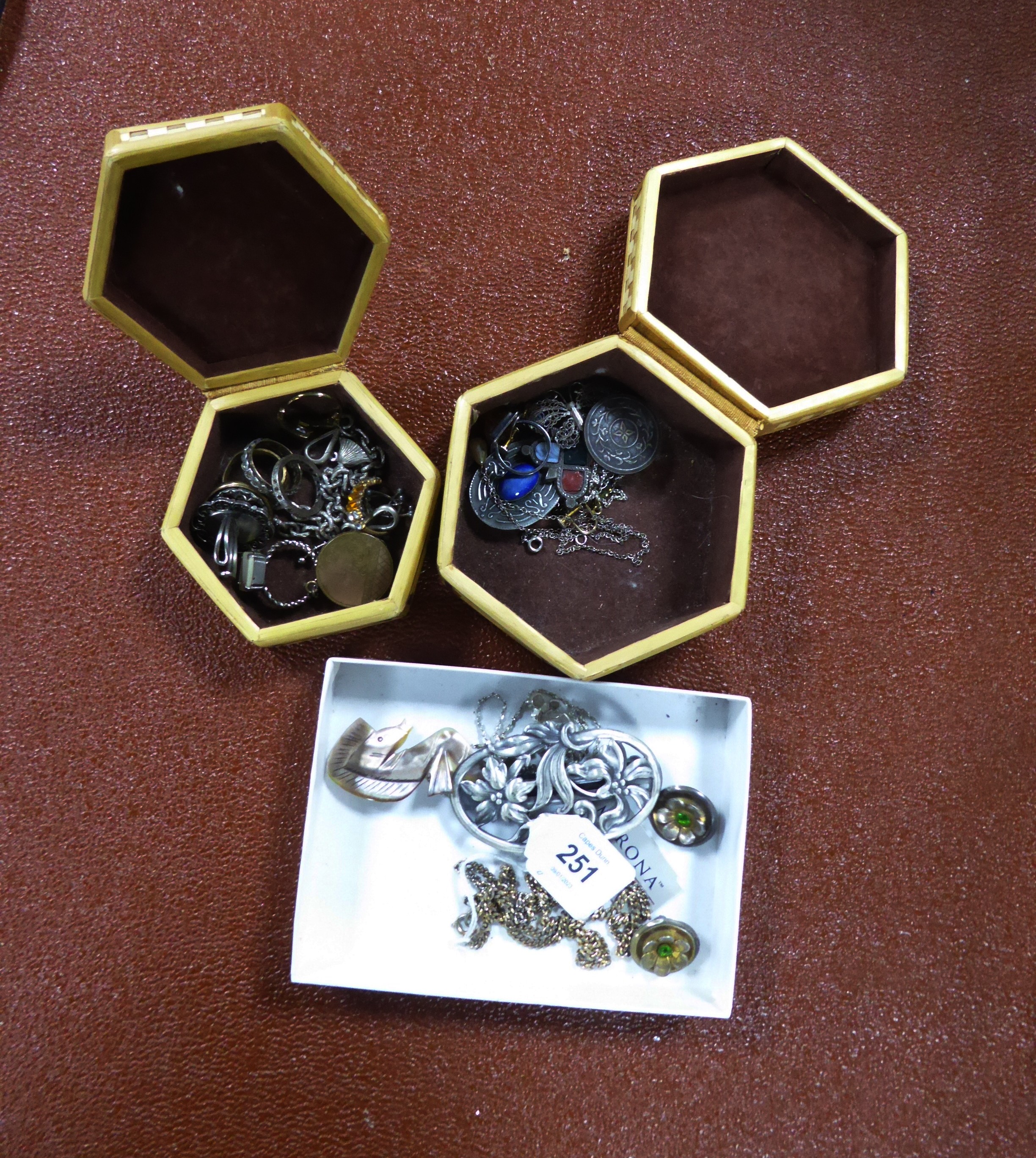 PAIR OF STERLING SILVER FLOWER PATTERN CLIP EARRINGS EACH SET WIHT A SMALL BLUE STONE; A GOLD PLATED