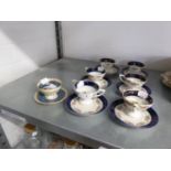 SET OF EARLY TWENTIETH CENTURY VIENNA PORCELAIN DEMI-TASSE COFFEE CUPS AND SAUCERS, DECORATED WITH