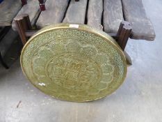 NORTH AFRICAN BRASS TRAY TOP FOLDING TABLE WITH PRESSED DECORATION, 23 3/4in (60cm) diameter