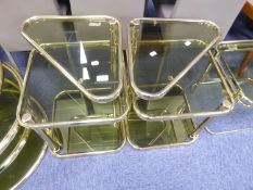 PAIR OF SQUARE THREE TIER GOLD COLOURED TUBULAR STEEL AND GLASS SIDE TABLES WITH SWIVEL TOPS [2]