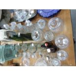 A COLLECTION OF GLASS BOTTLES, CARAFES, STORAGE JARS AND DECANTERS (22)