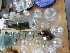 A COLLECTION OF GLASS BOTTLES, CARAFES, STORAGE JARS AND DECANTERS (22)